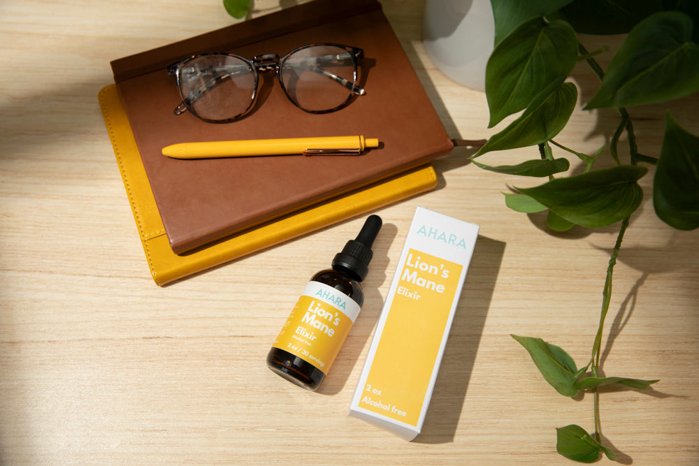 AHARA Lion's Mane elixir on a morning desk