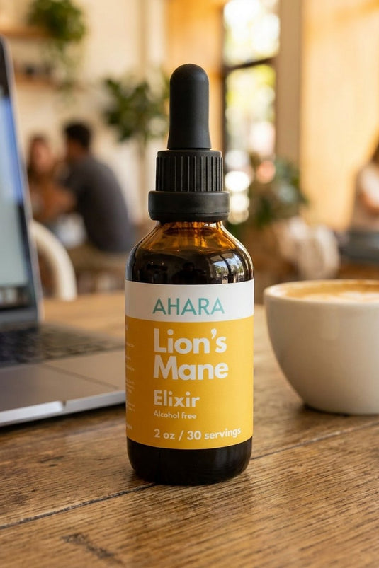 The AHARA Lion's Mane Elixir on a cafe table during a busy workday