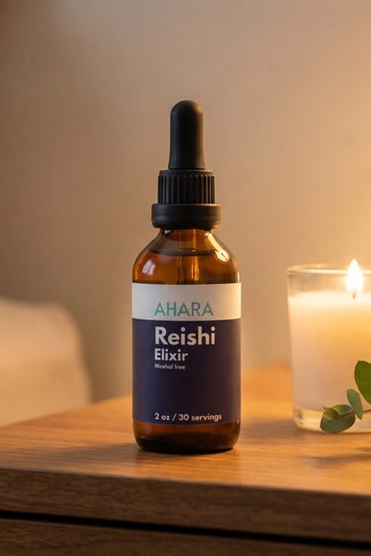 AHARA Reishi Elixir, a mushroom supplement for sleep, beside a candle
