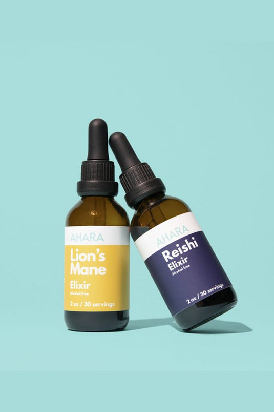 The AHARA Reishi and Lion's Mane Elixirs against a teal background